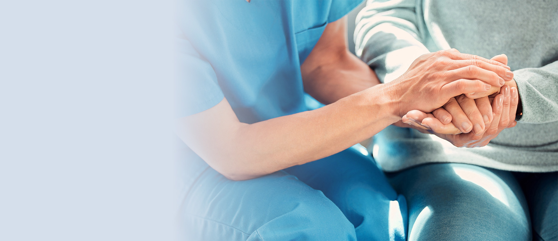 Doctor holding patient hands