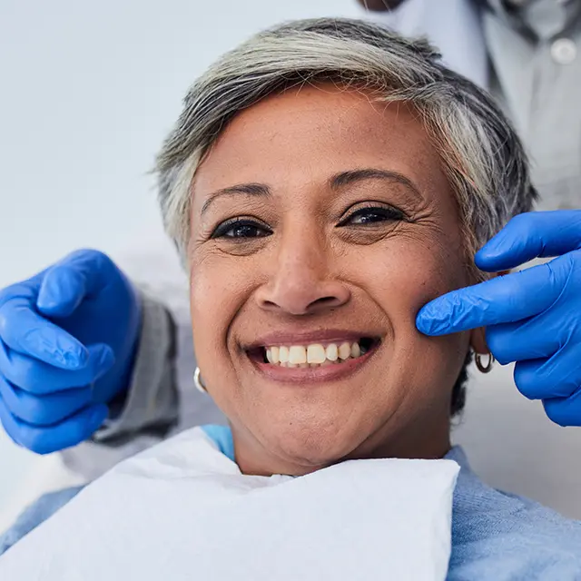 Checking dental health on patient